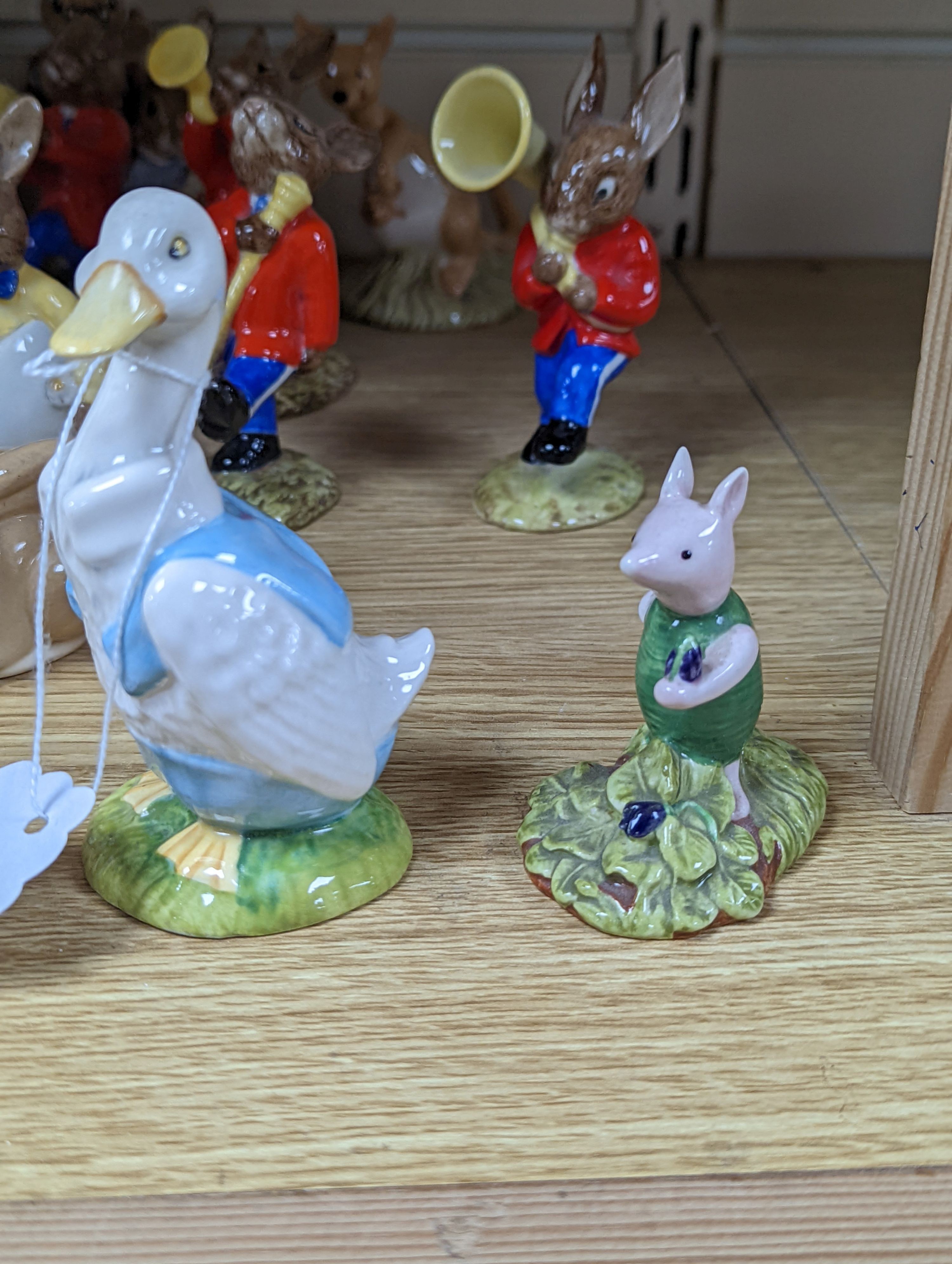A collection of Royal Doulton figures including Bunnykins, a Doulton vase and other items